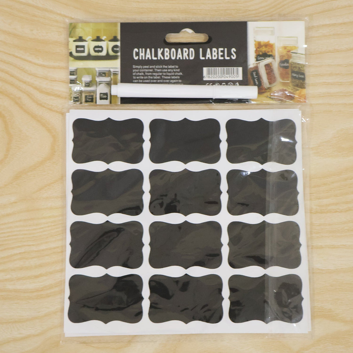 A packaged set of chalkboard labels and a white marker, with product information on the cardboard header.