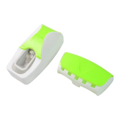 The white and lime green automatic toothpaste dispenser and toothbrush holder separated on a white background.