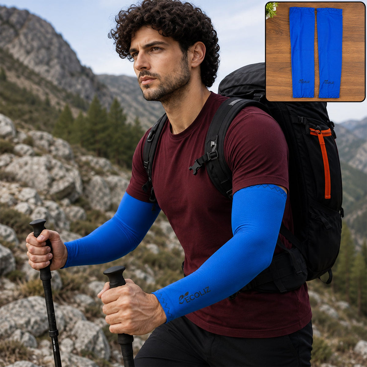 A man hiking on a rocky trail wears blue arm sleeves, a maroon t-shirt, and a black backpack.