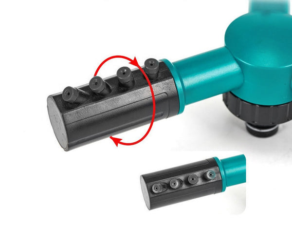 A close-up of the black sprinkler arm with red arrows indicating its rotational adjustment.