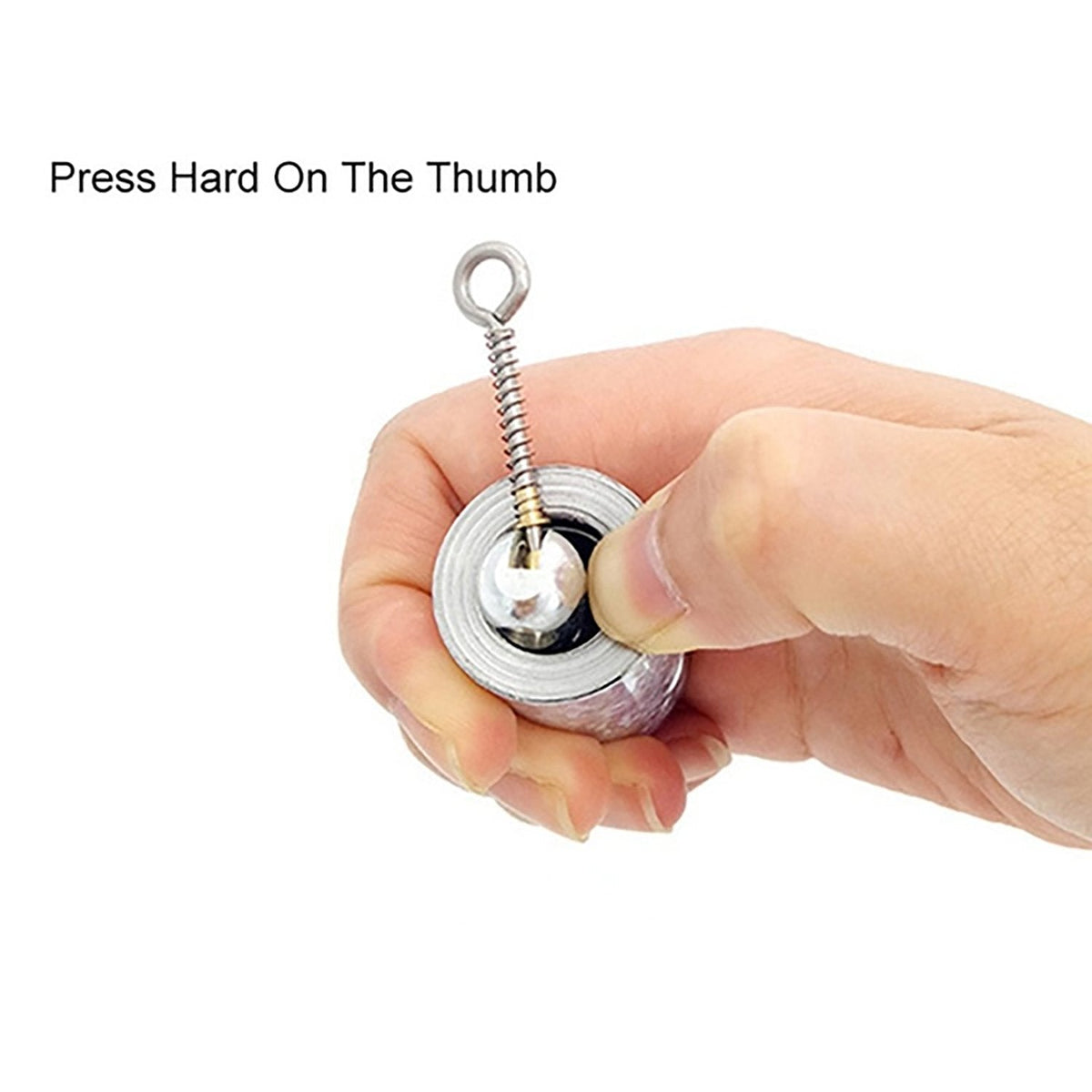 A hand presses a thumb on the release mechanism of the compact silver collapsible cane.
