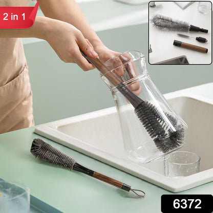 A person cleans a clear glass carafe with a long-handled grey brush, with an inset showing the brush disassembled.