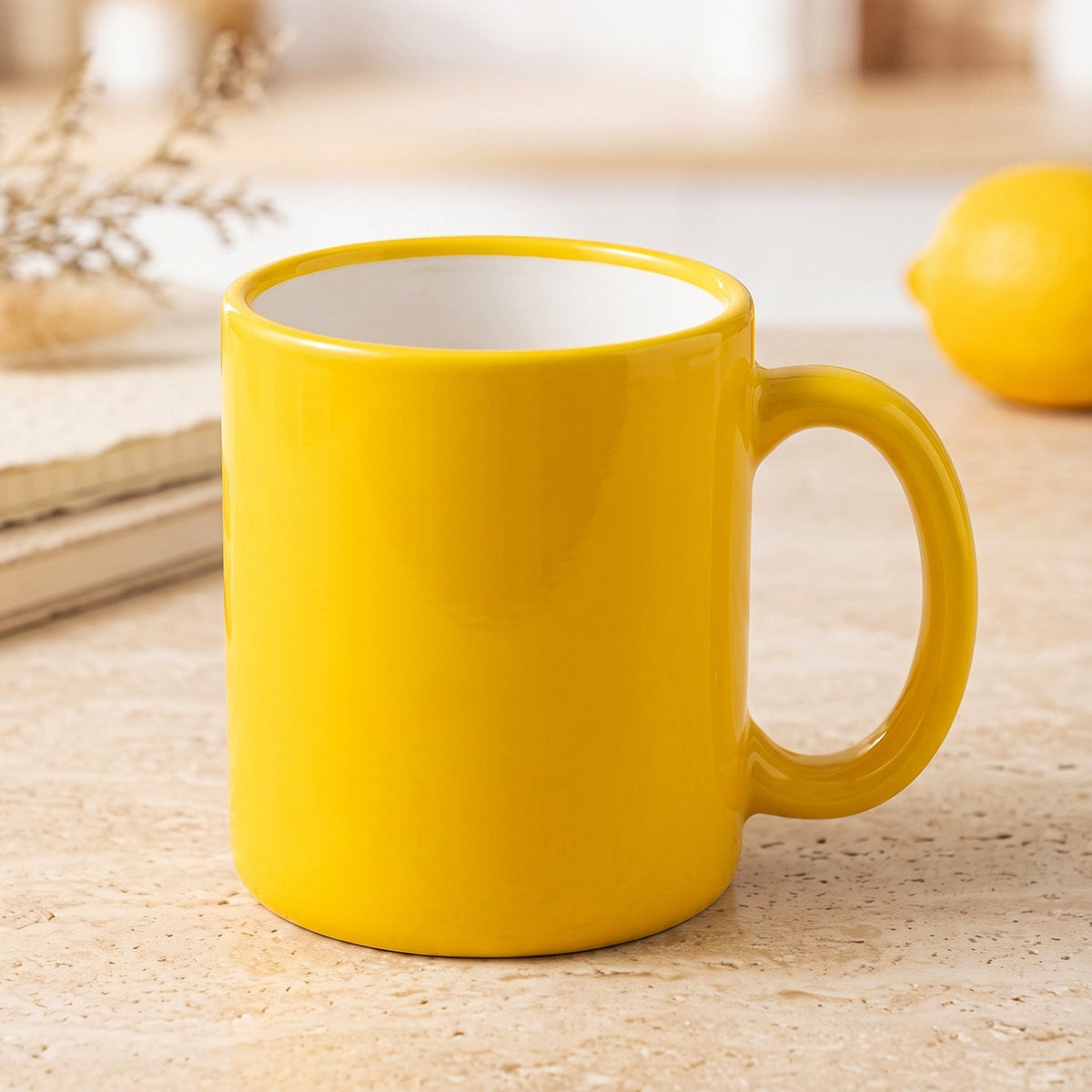 A woman in a light grey sweater holds a yellow mug to her lips, with a green potted plant visible behind her.