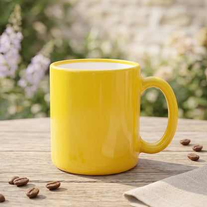 A woman in a cream sweater holds a yellow mug to her mouth, with a stainless steel kettle visible in the soft background.