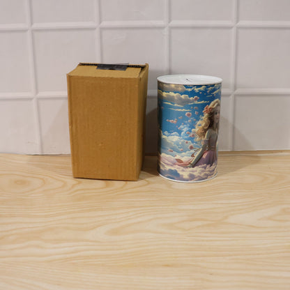 The princess-themed money bank stands next to a plain brown cardboard box on a light wooden surface.