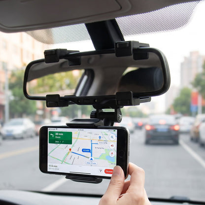 A black car phone mount attached to a rear view mirror, holding a smartphone displaying a navigation app. – view 7