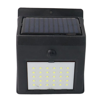 Front view of the black solar-powered wall light with 30 LEDs, featuring a solar panel on top and a motion sensor below.