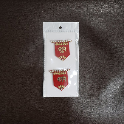 Two red Shubh Labh wall hangings with gold and clear stone embellishments, sealed in clear plastic packaging with a white