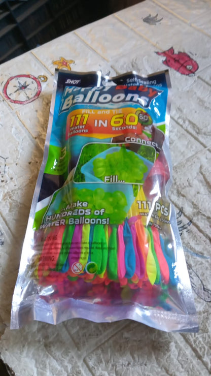 A stack of 111 multi-color self-tying water balloons packaging.